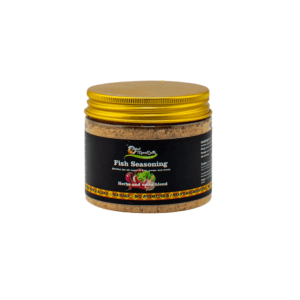 A jar of seasoning is sitting on the table.