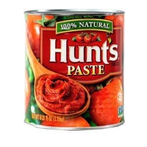 Large Hunt's tomato paste can with wooden spoon