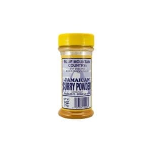 A jar of curry powder on top of a table.